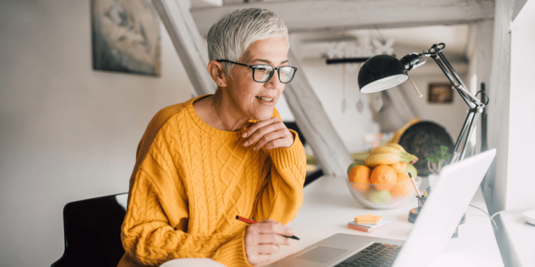 Retirement aged woman at her desk